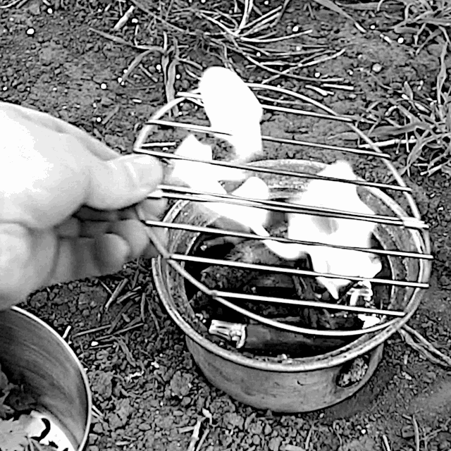 Using the Kelly Kettle: To use base to cook on, first place grille on top